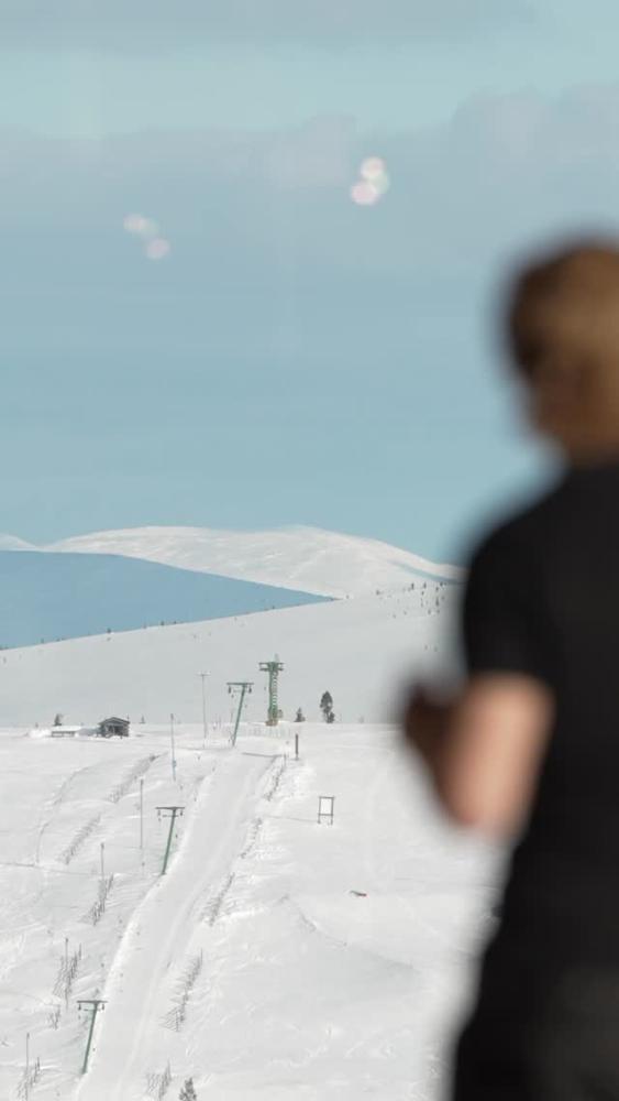 Sipping coffee and enjoying the snowy views with a...